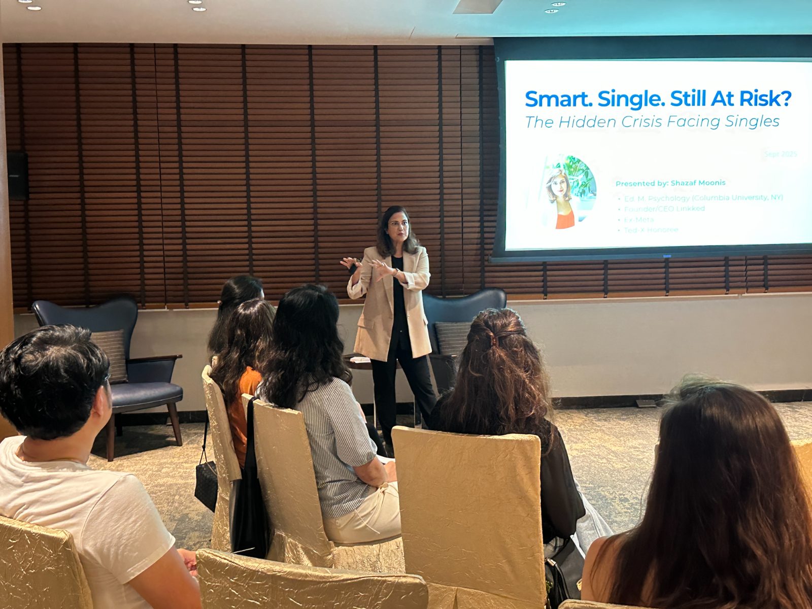 Shazaf Moonis delivering her 'Smart. Single. Still At Risk?' talk to a seated audience